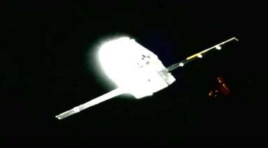 Mysterious Triangular Object Floats Past SpaceX Dragon Capsule