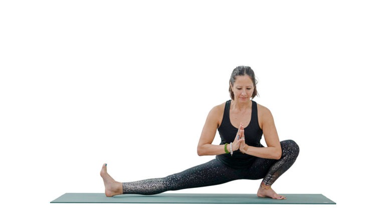 Yoga practice shows lateral yoga flow with warrior 1 pose in a sun  salutation