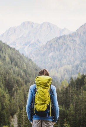 young man traveler in a mountains